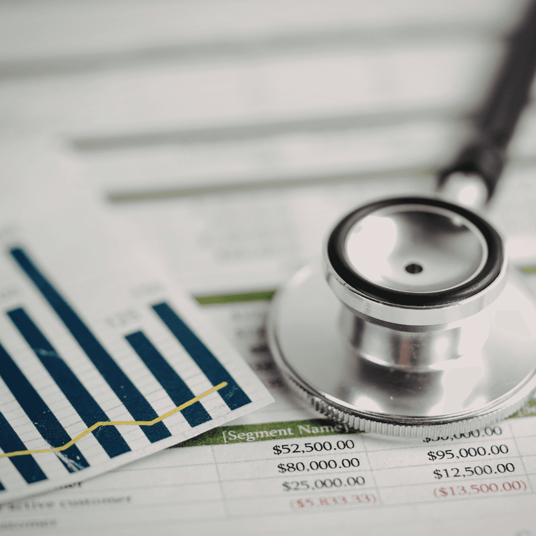 Stethoscope resting on financial documents, bridging healthcare and revenue